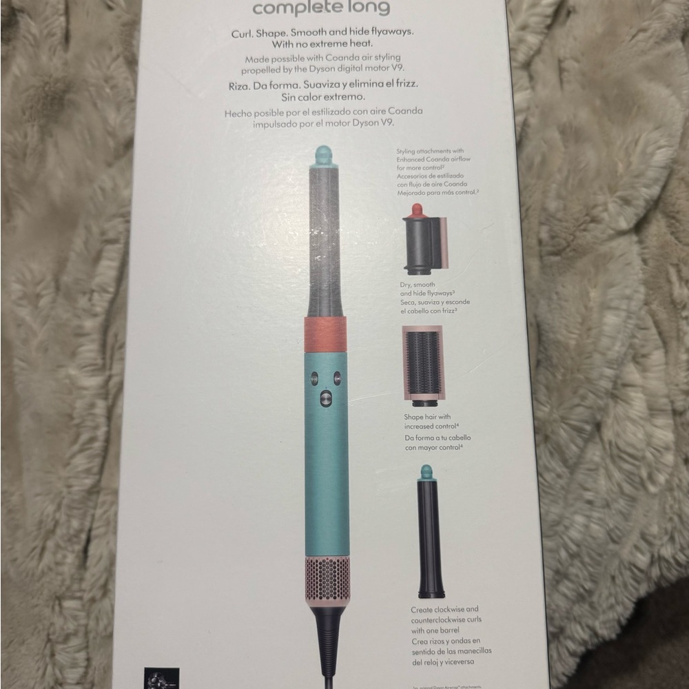 Dyson styling wand in teal with coral accents
